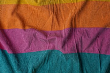 bright colored striped fabric texture of a piece of crumpled cloth