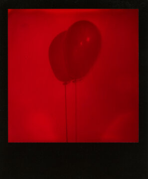 Red Duochrome polaroid scan of a balloon