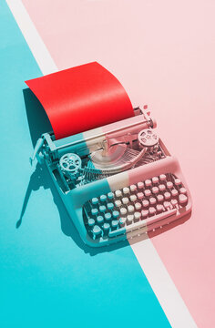 Typing machine in colorful composition.