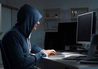 Hacker hacking computer at night