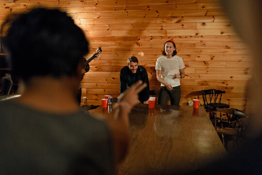 A group of friends play party games in a cabin update New York