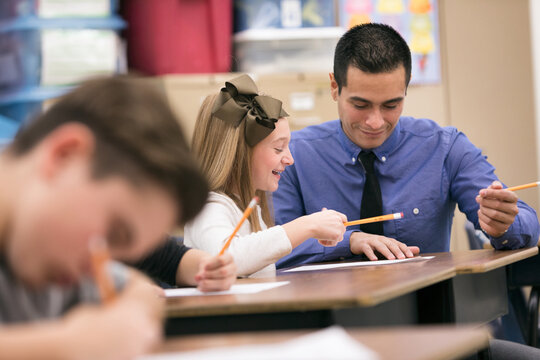 Classroom: Girl Student Gets Help From Teacher