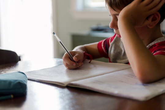 little boy doing his homework