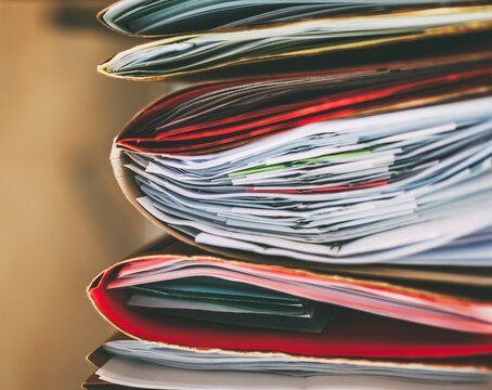 Stack of documents folders on office.
