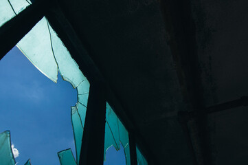 broken glass window with sky