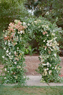 Rustic outdoor wedding ceremony arch
