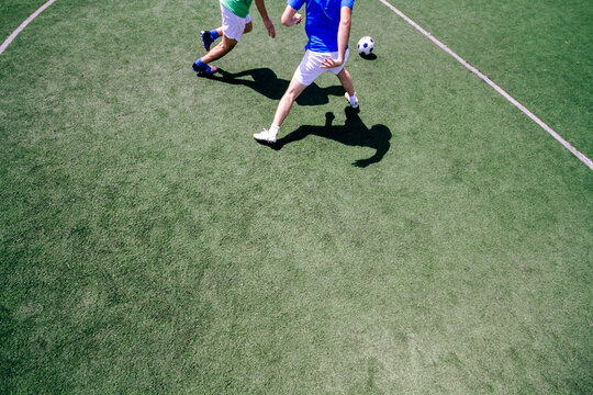 Two soccer players playing in a soccer field during a match