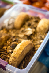 Regional cheeses preserved in dried mushroom flakes on display at Kotor market,Bay of Kotor,Montenegro.