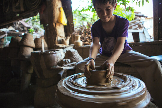A boy's pottery session