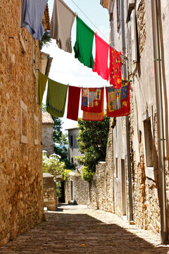 Laundry on rope in front of a old stone house