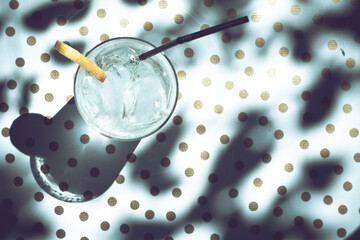 glass of fresh soda in polka dot tablecloth