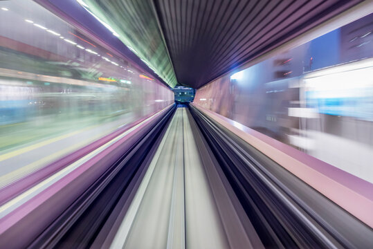 Speed and motion from fast train passing a train station