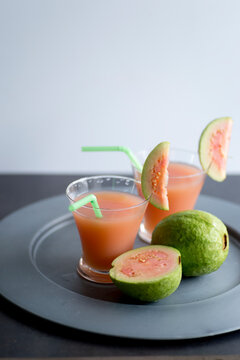 Pink guava juice on metal plate