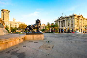 Lion statues at the base of the Columbus Monument on the coast of Barcelona Spain in the early...