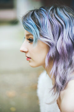 Portrait of a young woman with blue-violet hair