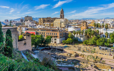 Fototapeta na wymiar View on Malaga in Andalucia (Spain) from the Alcazaba mirador. We cann the cathedral, the palm trees and the historic center