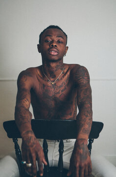 Young tattooed black man modelling