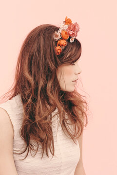 Beauty portrait of young woman with flowers in hair