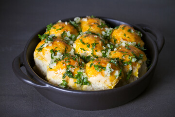 Garlic bread, buns. Bread rolls with garlic and parsley. horizontal photo