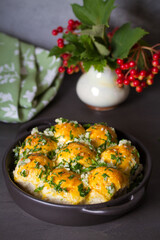 Garlic bread, buns. Bread rolls with garlic and parsley. vertical photo