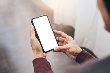 cell phone blank white screen mockup.woman hand holding texting using mobile on desk at office.background empty space for advertise.work people contact marketing business,technology