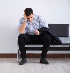 Man nervously impatiently waiting in the lobby
