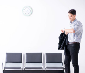 Man nervously impatiently waiting in the lobby