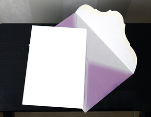 postcard and pink envelope on a dark background for mockup, selective focus