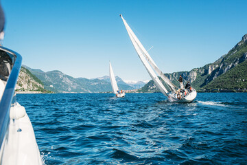 Sailboats sailing on the lake