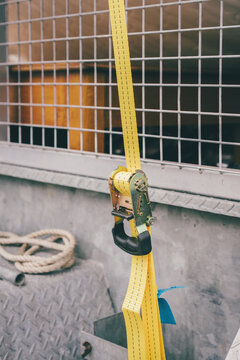 secure strap on a trailer loaded with furniture