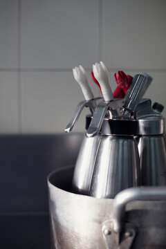 Professional whipping siphons in a water bath