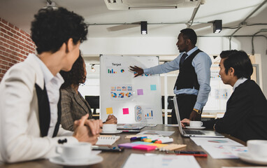 African Americans are leading graph business meetings with people of diversity nationalities in office conference rooms. Concept Diversity meeting business room.