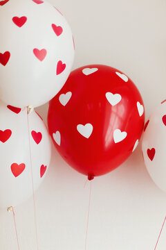 White and read heart decorated balloons floating