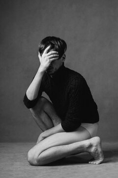 Depressed and faceless male model portrait in studio