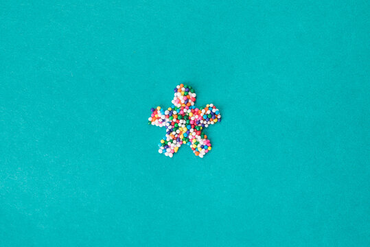 The ""asterisk/star"" symbol built from nonpareils