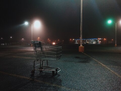 shopping cart in empty parking lot