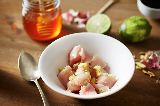 Raw chicken breast with herbs