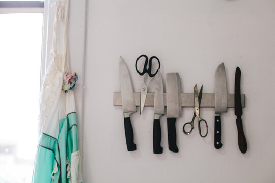 A wall mounted knife magnet.
