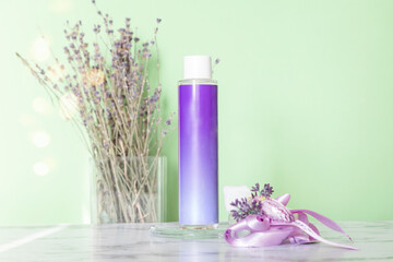 Cosmetic skincare cream on marble background. Eco-friendly lavender aromatherapy cosmetics.