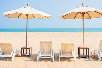 Umbrella and chair around beach sea ocean on blue sky