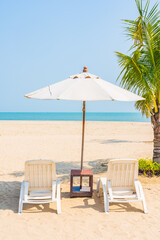 Umbrella and chair around beach sea ocean on blue sky