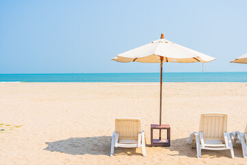 Umbrella and chair around beach sea ocean on blue sky