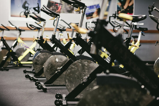 Many spin bikes in a group exercise room