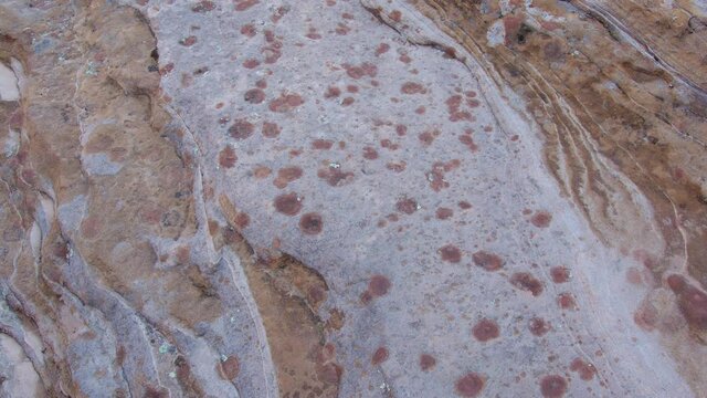 Patterns with lines and spots in sandstone in Zion wilderness in the Utah desert.