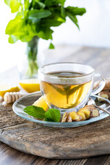 Green tea with ginger and other ingredients to infuse into the tea.