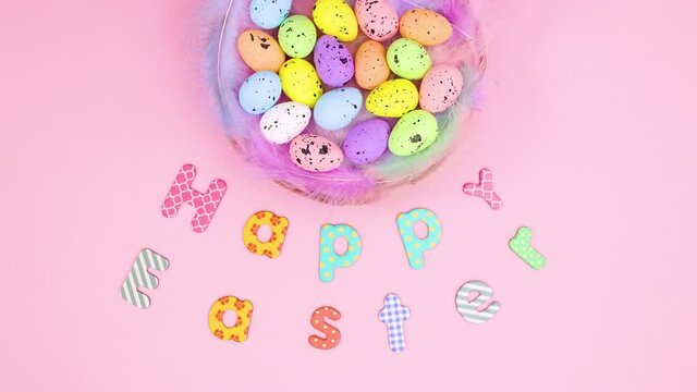 Happy Easter text and eggs in basket move on paste pink theme. Stop motion 