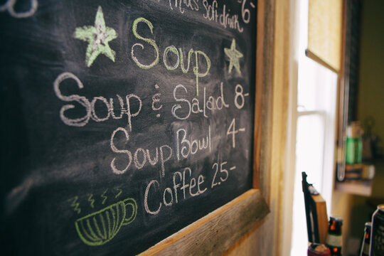 Pizza: Menu Items On Chalkboard In Restaurant