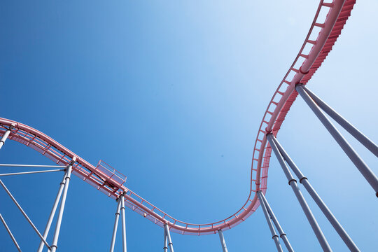Tracks Of Roller Coaster Against Blue Sky