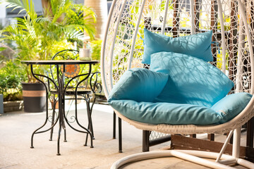 garden swing with mattress and cushion in the morning horizontal composition