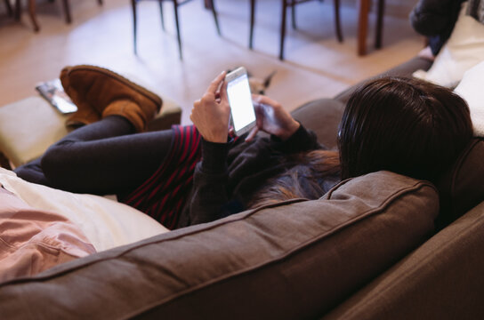 Woman use smartphone on a couch